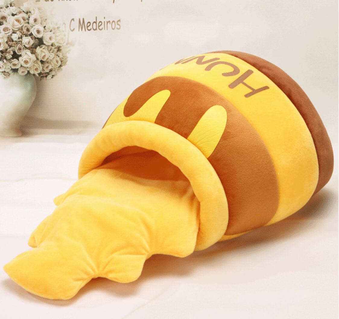 Cozy honey jar-shaped cat bed with soft yellow cushion and plush interior for kittens and small pets